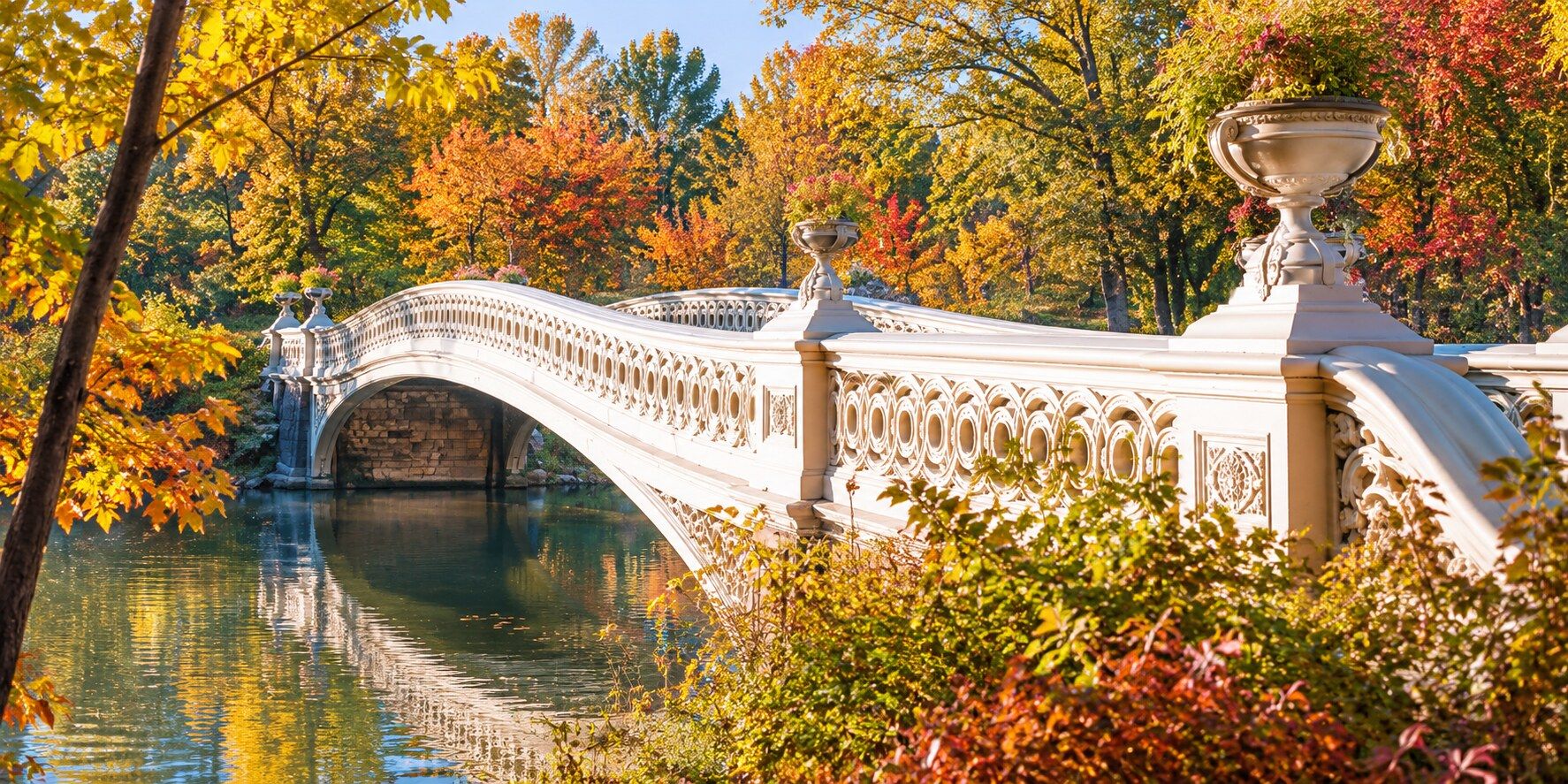 Bow Bridge in Central Park surrounded by autumn foliage